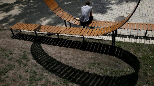 A man rests on a bench in a park in central Kiev, Ukraine. (Valentyn Ogirenko / REUTERS)
