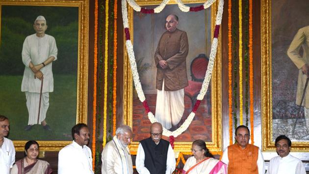 Prime Minister Narendra Modi (4L), Lok Sabha speaker Sumitra Mahajan (3R), Deputy speaker Thambi Durai (3L), External Affairs Minister Sushma Swaraj (2L), senior BJP leaders L K Advani (4R) and Subramanian Swamy (2L) pay tribute to Bharatiya Jana Sangh founder Syama Prasad Mookerjee on his birth anniversary at Parliament House. (Arvind Yadav / HT Photo) Prime Minister Narendra Modi (4L), Lok Sabha speaker Sumitra Mahajan (3R), Deputy speaker Thambi Durai (3L), External Affairs Minister Sushma Swaraj (2L), senior BJP leaders L K Advani (4R) and Subramanian Swamy (2L) pay tribute to Bharatiya Jana Sangh founder Syama Prasad Mookerjee on his birth anniversary at Parliament House. (Arvind Yadav / HT Photo)