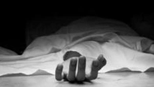 The dead man's body. Focus on hand