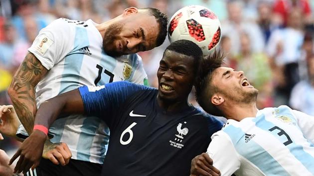 France's midfielder Paul Pogba (C) heads the ball with Argentina's defender Nicolas Otamendi (L) and Argentina's defender Nicolas Tagliafico during the Russia 2018 World Cup round of 16 football match between France and Argentina at the Kazan Arena in Kazan, Russia. (Franck Fife / AFP)