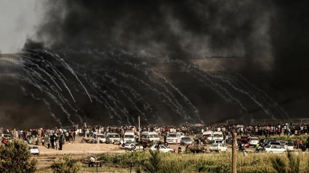 Israeli forces fire tear gas at demonstrators east of Gaza City along the border between the Gaza Strip and Israel, during confrontations with Palestinian protesters. (Mahmud Hams / AFP)