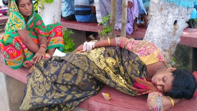 Locals rescued Sulekha Bibi in an unconscious state and rushed her to Hariharpara hospital after she jumped off the moving car. (HT Photo) Locals rescued Sulekha Bibi in an unconscious state and rushed her to Hariharpara hospital after she jumped off the moving car. (HT Photo)