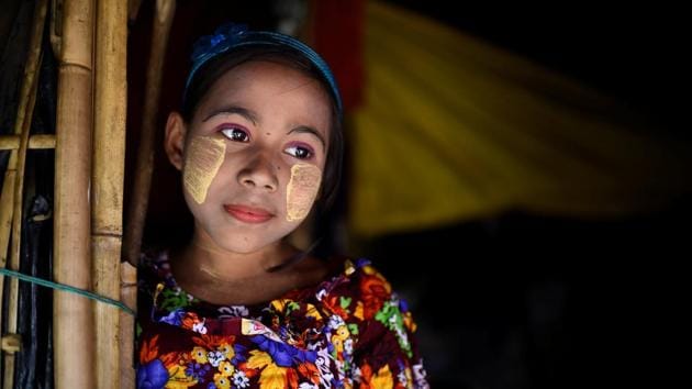 Romzida, 8, at Shamlapur camp in Cox's Bazaar. Thanaka, a type of sun protection that dates back centuries, is a common sight on the faces of the women, who say the use of the traditional cooling paste helps bring a sense of normality to their difficult lives in the camps. (Clodagh Kilcoyne / REUTERS) Romzida, 8, at Shamlapur camp in Cox's Bazaar. Thanaka, a type of sun protection that dates back centuries, is a common sight on the faces of the women, who say the use of the traditional cooling paste helps bring a sense of normality to their difficult lives in the camps. (Clodagh Kilcoyne / REUTERS)