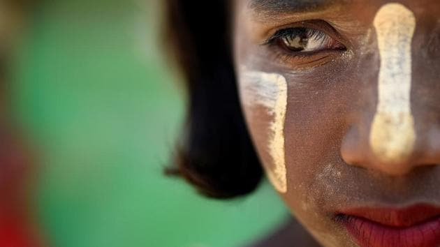 Portrait of 10-year-old Shamima. The paste is applied to the face in various patterns and dries into a protective layer. While it is used medicinally elsewhere in Asia, women in Myanmar also use it as a cosmetic. (Clodagh Kilcoyne / REUTERS) Portrait of 10-year-old Shamima. The paste is applied to the face in various patterns and dries into a protective layer. While it is used medicinally elsewhere in Asia, women in Myanmar also use it as a cosmetic. (Clodagh Kilcoyne / REUTERS)