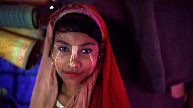 Senuara Begum, aged 14, at Jamtoli camp in Cox’s Bazaar. Thanaka is produced from the bark of a tree found in the dry central parts of Myanmar. A flat stone called a kyauk pyin is used to grind the bark into a milky yellow paste. (Clodagh Kilcoyne / REUTERS) Senuara Begum, aged 14, at Jamtoli camp in Cox’s Bazaar. Thanaka is produced from the bark of a tree found in the dry central parts of Myanmar. A flat stone called a kyauk pyin is used to grind the bark into a milky yellow paste. (Clodagh Kilcoyne / REUTERS)