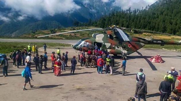 Indian pilgrims being evacuated from Simikot to Surkhet and Nepalganj, as authorities stepped up efforts to rescue those stranded there due to heavy rain while returning from the Kailash Mansarovar pilgrimage in Tibet in Simikot on Wednesday. (PTI Photo) Indian pilgrims being evacuated from Simikot to Surkhet and Nepalganj, as authorities stepped up efforts to rescue those stranded there due to heavy rain while returning from the Kailash Mansarovar pilgrimage in Tibet in Simikot on Wednesday. (PTI Photo)