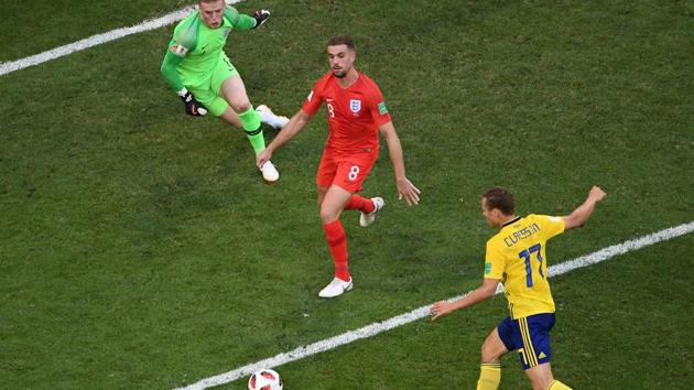 Sweden's midfielder Viktor Claesson (R) tries a shot against England's goalkeeper Jordan Pickford (L) and England's midfielder Jordan Henderson during the Russia 2018 World Cup quarter-final. (AFP) Sweden's midfielder Viktor Claesson (R) tries a shot against England's goalkeeper Jordan Pickford (L) and England's midfielder Jordan Henderson during the Russia 2018 World Cup quarter-final. (AFP)
