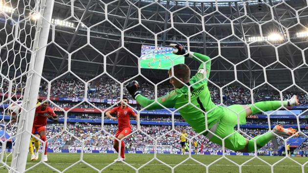 England's goalkeeper Jordan Pickford dives during the Russia 2018 World Cup quarter-final football match between Sweden and England at the Samara Arena in Samara. (AFP) England's goalkeeper Jordan Pickford dives during the Russia 2018 World Cup quarter-final football match between Sweden and England at the Samara Arena in Samara. (AFP)