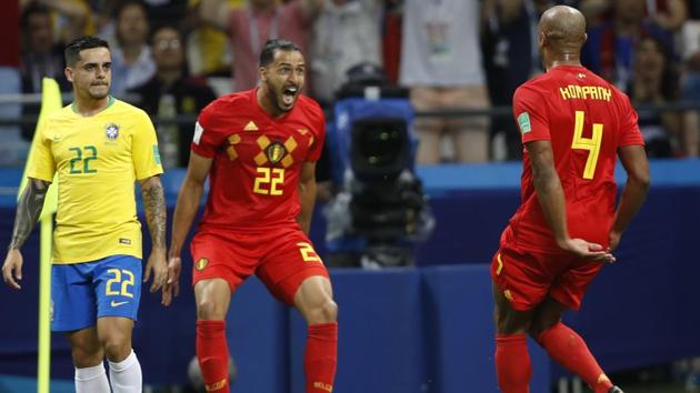 Brazil's Fagner, left, looks on as Belgium's Nacer Chadli and Vincent Kompany, right, celebrate their first goal. (AP) Brazil's Fagner, left, looks on as Belgium's Nacer Chadli and Vincent Kompany, right, celebrate their first goal. (AP)