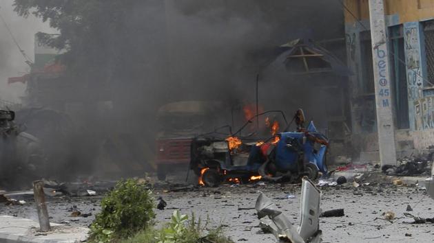 A car burns after the blast in Mogadishu, Somalia, on Saturday, July, 7, 2018. (AP) A car burns after the blast in Mogadishu, Somalia, on Saturday, July, 7, 2018. (AP)