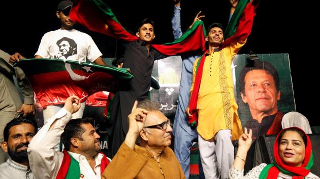 Supporters of Imran Khan, chairman of the Pakistan Tehreek-e-Insaf (PTI) political party, dance to celebrate the verdict of accountability court on an anti-corruption case against ousted Prime Minister Nawaz Sharif and his daughter, on a campaign truck in Karachi, Pakistan on July 6.(REUTERS)
