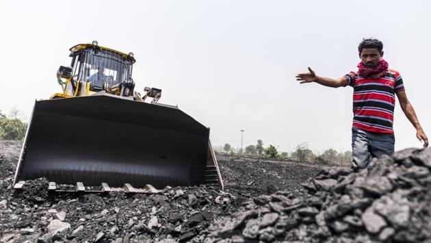 A man directs a front loader at the Tori Siding. The addition of the two mines is expected to add another 47 million tonne peak production capacity to CCL’s output, which stood at 67.6 million tonnes for financial year 2017-18. (Prashanth Vishwanathan / Bloomberg) A man directs a front loader at the Tori Siding. The addition of the two mines is expected to add another 47 million tonne peak production capacity to CCL’s output, which stood at 67.6 million tonnes for financial year 2017-18. (Prashanth Vishwanathan / Bloomberg)