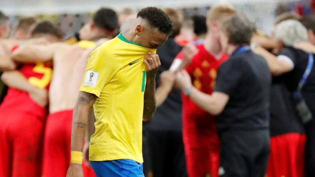 Brazil’s Neymar looks dejected at the end of the match as Belgium players celebrate their win in the Brazil vs Belgium Quarter Final at the Kazan Arena in Kazan, Russia. (Toru Hanai / REUTERS)