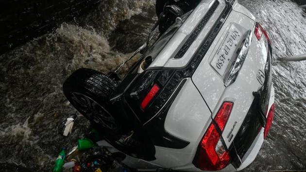 A car that was washed away during heavy rains in Andheri, Mumbai on Sunday. (Shashi S kashyap/HT Photo)