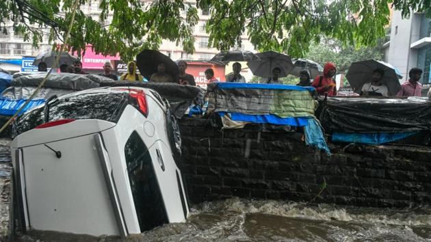 A car that was washed away during heavy rains in Andheri, Mumbai on Sunday. (Shashi S Kashyap/HT Photo)