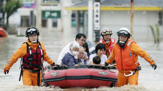 Local residents sit in a boat as they are rescued from a flooded area at a hospital in Kurashiki, Okayama Prefecture. (REUTERS) Local residents sit in a boat as they are rescued from a flooded area at a hospital in Kurashiki, Okayama Prefecture. (REUTERS)