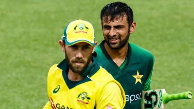 Pakistan batsman Shoaib Malik is congratulated by Glenn Maxwell after victory in action during the final of the tri-series played between Pakistan and Australia in a T20 tri-series which at the Harare Sports Club, July 8 2018.(AFP)