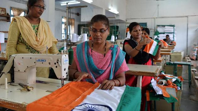 Employees of Khadi Gramodyog Samyukta Sangh (KGSS) stitch together a national flag at the Indian National Flag Production Centre in Bengeri, Karnataka. When top Indian officials salute the national flag anywhere in the world, women in villages at the other end of the country from New Delhi swell with pride. (Manjunath Kiran / AFP)