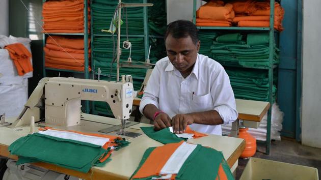 Tulasigeri is home to India’s only official flag-making company -- and the local men have proved themselves not up to the job. “The men were not as patient as the women and got the measurements wrong,” groaned Annapurna Koti, a supervisor at KGSS. “They had to unstitch the cloth and re-do the time consuming process,” she told AFP. “They left after the fourth day and never returned.” (Manjunath Kiran / AFP)