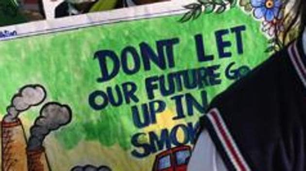 Representative photo. SDPchool children wearing pollution masks hold placards as they participate in a march to raise awareness of air pollution levels in New Delhi on November 15, 2017. (AFP FILE) Representative photo. SDPchool children wearing pollution masks hold placards as they participate in a march to raise awareness of air pollution levels in New Delhi on November 15, 2017. (AFP FILE)