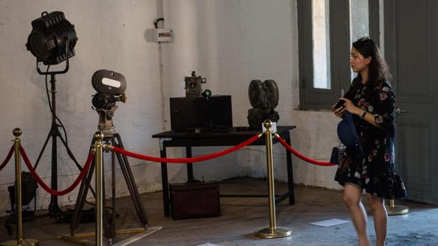 A visitor views a display at the Myanmar film heritage exhibition. “Each time the restoration progressed, it was like a new birth for the film,” said Severine Wemaere, co-founder of MEMORY! Cinema, which oversaw the restoration and raised funds from donors for the $100,000 price tag. “It was very moving because we could tell that we were in a country of cinema.” (Phyo Hein Kyaw / AFP) A visitor views a display at the Myanmar film heritage exhibition. “Each time the restoration progressed, it was like a new birth for the film,” said Severine Wemaere, co-founder of MEMORY! Cinema, which oversaw the restoration and raised funds from donors for the $100,000 price tag. “It was very moving because we could tell that we were in a country of cinema.” (Phyo Hein Kyaw / AFP)