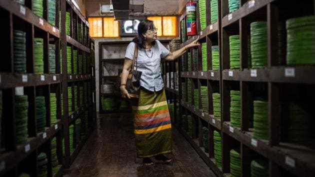 Actor Grace Swe Zin Htaik views old films at the state archive in Yangon. The survival of Myanmar’s earliest film around, “Mya Ga Naing” (The Emerald Jungle), is perhaps as unlikely a feat as its lead role’s triumph over pythons and bandits with his bare hands. The country’s once flourishing film scene was hit with the military junta’s arrival in 1962 that brought stringent censorship during a 50-year reign. (Phyo Hein Kyaw / AFP)