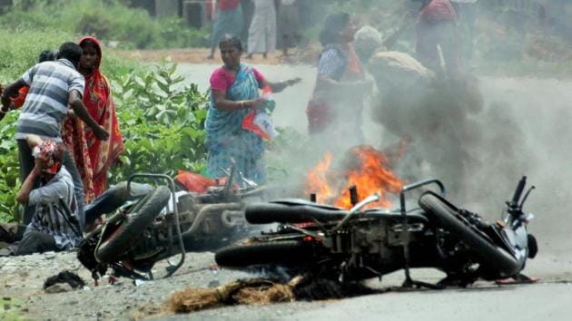 A vehicle is set on fire during the violence that erupted during the recently held panchayat elections in West Bengal. To understand the scale of local political violence, it is important to understand the state’s political structure.(PTI File Photo)