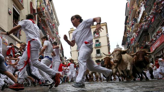 The bull runs are the highlight of the world-famous fiesta, and its seamless nine days and eight nights of traditional events, music and alcohol-soaked parties attract around one million visitors every year to the city of nearly 200,000. (Susana Vera / REUTERS) The bull runs are the highlight of the world-famous fiesta, and its seamless nine days and eight nights of traditional events, music and alcohol-soaked parties attract around one million visitors every year to the city of nearly 200,000. (Susana Vera / REUTERS)