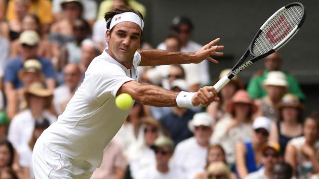 Switzerland's Roger Federer returns to France's Adrian Mannarino in their men's singles fourth round match on the seventh day of the 2018 Wimbledon Championships at The All England Lawn Tennis Club in Wimbledon, London, on July 9, 2018.(AFP)