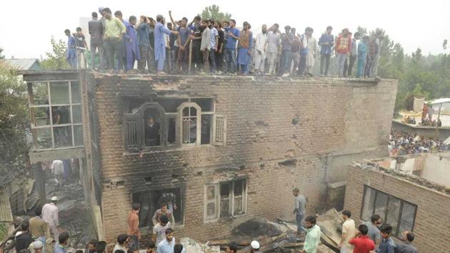 The two militants were killed in Kundalan village after they opened fire on security forces, triggering a gun battle. (Waseem Andrabi/HT Photo) The two militants were killed in Kundalan village after they opened fire on security forces, triggering a gun battle. (Waseem Andrabi/HT Photo)