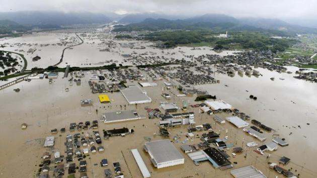 An aerial view shows submerged houses and facilities at a flooded area in Kurashiki. Days of heavy rainfall that weather officials have called historic set off flooding and landslides in western Japan, including Hiroshima, Okayama and Ehime prefectures. Many people started to return and check on their homes and begin cleanup after the rain stopped Monday. (Kyodo via REUTERS) An aerial view shows submerged houses and facilities at a flooded area in Kurashiki. Days of heavy rainfall that weather officials have called historic set off flooding and landslides in western Japan, including Hiroshima, Okayama and Ehime prefectures. Many people started to return and check on their homes and begin cleanup after the rain stopped Monday. (Kyodo via REUTERS)