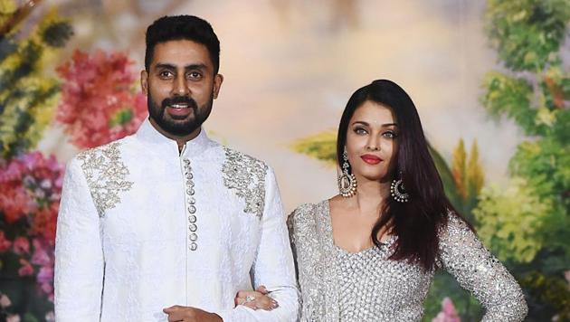 Abhishek Bachchan with his wife Aishwarya Rai Bachchan pose for a picture during the wedding reception of actor Sonam Kapoor and businessman Anand Ahuja in Mumbai on May 8, 2018.(AFP)