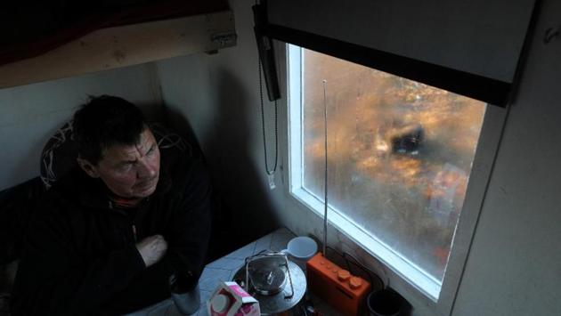 Sara takes rest in a small cabin near Lake Iesjavri, as his dog Chappe waits outside. The herders insist they are not opposed to change -- their language has no word for “stability” -- but Sara said the politicians were not listening. “If this mine gets the go ahead, we will go to the courts to stop it. ” (Stoyan Nenov / REUTERS)