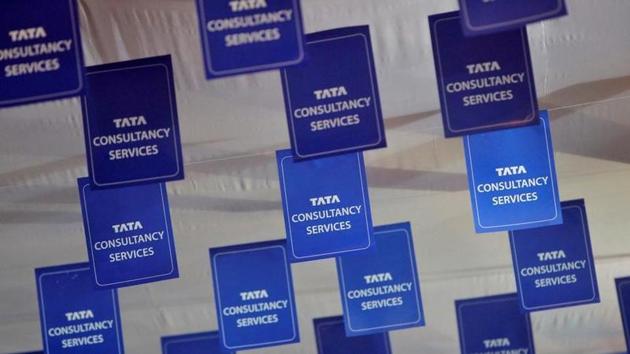Logos of Tata Consultancy Services (TCS) are displayed at the venue of the annual general meeting of the software services provider in Mumbai.(Reuters File Photo)