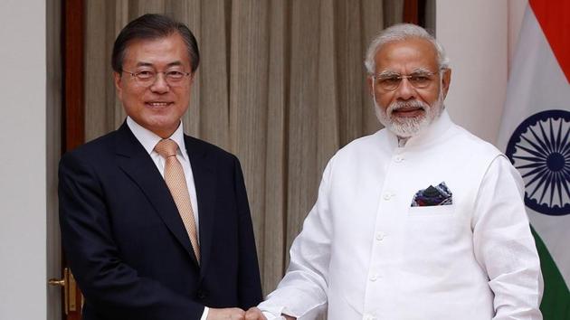 South Korean President Moon Jae-in shakes hands with Prime Minister Narendra Modi ahead of their meeting at Hyderabad House in New Delhi, on Tuesday.(REUTERS)