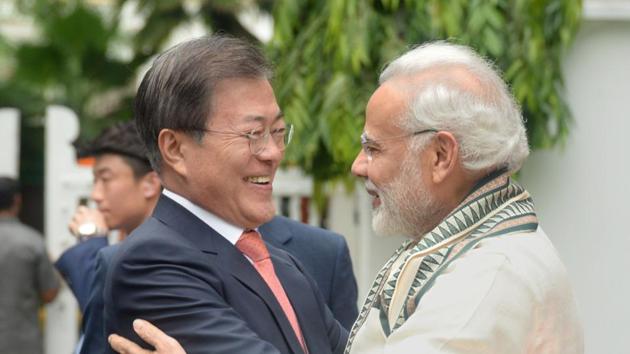 South Korean President Moon Jae-in is hugged by Prime Minister Narendra Modi during their visit to Gandhi Smriti in Delhi on July 9, 2018.(REUTERS)