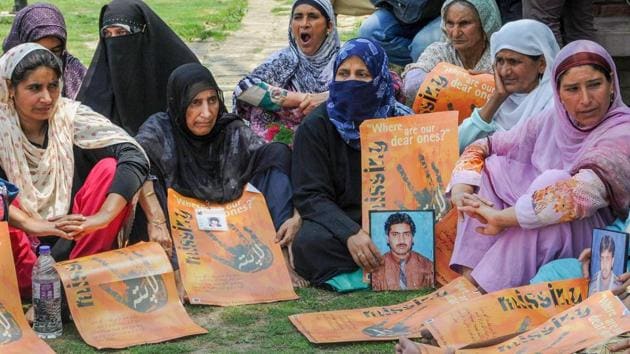Relatives of missing persons display placards during a silent sit-in protest in Srinagar on July 10, 2018. (PTI) Relatives of missing persons display placards during a silent sit-in protest in Srinagar on July 10, 2018. (PTI)