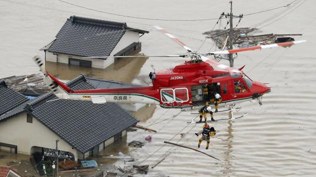 A local resident is rescued from a submerged house by a rescue helicopter in Kurashiki. The crisis is the deadliest rain-related disaster in over three decades, and one that has sparked national grief. On Monday Prime Minister Shinzo Abe cancelled a four-stop foreign trip as the death toll rose. (Kyodo via REUTERS) A local resident is rescued from a submerged house by a rescue helicopter in Kurashiki. The crisis is the deadliest rain-related disaster in over three decades, and one that has sparked national grief. On Monday Prime Minister Shinzo Abe cancelled a four-stop foreign trip as the death toll rose. (Kyodo via REUTERS)