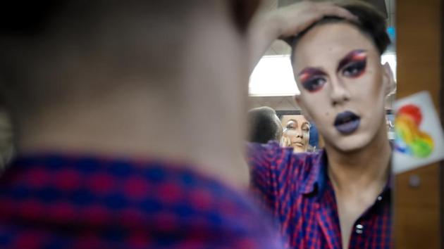 Outside, the men lead a different life, where they don’t advertise their sexual preferences for fear of professional, personal or even physical backlash. A rainbow-colored card tucked in a mirror is both a statement and reminder that, while Pride marches took place this weekend in London, Madrid and other European capitals, displaying rainbow flags in public in Russia can violate the law. (Vadim Ghirda / AP) Outside, the men lead a different life, where they don’t advertise their sexual preferences for fear of professional, personal or even physical backlash. A rainbow-colored card tucked in a mirror is both a statement and reminder that, while Pride marches took place this weekend in London, Madrid and other European capitals, displaying rainbow flags in public in Russia can violate the law. (Vadim Ghirda / AP)