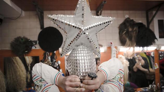 Bomba dons an embroidered Slavic-style blouse and headgear topped with a silver star, reminiscent of the stars perched on the towers of the Kremlin. When she performs a Russian traditional dance, the crowd goes wild. (Vadim Ghirda / AP) Bomba dons an embroidered Slavic-style blouse and headgear topped with a silver star, reminiscent of the stars perched on the towers of the Kremlin. When she performs a Russian traditional dance, the crowd goes wild. (Vadim Ghirda / AP)