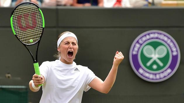 Latvia's Jelena Ostapenko celebrates after winning against Slovakia's Dominika Cibulkova during their women's singles quarter-final match on the eighth day of the 2018 Wimbledon Championships at The All England Lawn Tennis Club in Wimbledon, southwest London, on July 10, 2018. Ostapenko won the match 7-5, 6-4.(AFP)