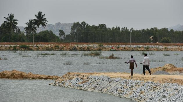 Lakshmisagara Lake in Karnataka’s arid Kolar district seen filled with the treated waste water coming from Bengaluru to increase the region’s groundwater. On June 2, when water gushed into the lake, the previous Siddaramaiah-led state government’s ambitious plan came to completion. However, a month later, villagers have turned sceptical of this Rs 1,342-crore project, fearing that the scheme was supplying “toxic water” to the region’s lakes. (Arijit Sen / HT Photo) Lakshmisagara Lake in Karnataka’s arid Kolar district seen filled with the treated waste water coming from Bengaluru to increase the region’s groundwater. On June 2, when water gushed into the lake, the previous Siddaramaiah-led state government’s ambitious plan came to completion. However, a month later, villagers have turned sceptical of this Rs 1,342-crore project, fearing that the scheme was supplying “toxic water” to the region’s lakes. (Arijit Sen / HT Photo)