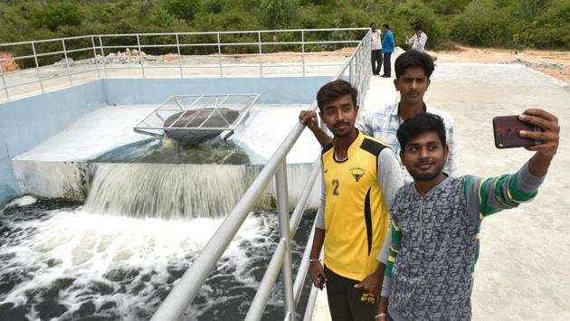 Boys take pictures at Lakshmisagara Lake. Rudraiah said that the end goal is to turn the arid Kolar and Chikkaballapura districts into water surplus ones. Karnataka’s minor irrigation minister CS Puttaraju said, “I have been informed about fears of the people there and have conveyed them to chief minister Kumaraswamy. We have asked the department to look at providing tertiary treatment for the water to make it fit for drinking.” (Arijit Sen / HT Photo) Boys take pictures at Lakshmisagara Lake. Rudraiah said that the end goal is to turn the arid Kolar and Chikkaballapura districts into water surplus ones. Karnataka’s minor irrigation minister CS Puttaraju said, “I have been informed about fears of the people there and have conveyed them to chief minister Kumaraswamy. We have asked the department to look at providing tertiary treatment for the water to make it fit for drinking.” (Arijit Sen / HT Photo)