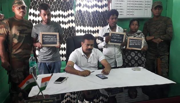 The three people held with the contraband in Jalpaigudi on Wednesday. (HT Photo) The three people held with the contraband in Jalpaigudi on Wednesday. (HT Photo)