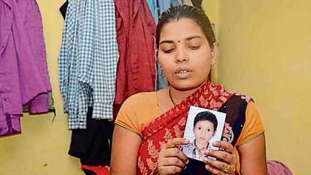 Anita, mother of 13-year-old Kishan who has been missing for nearly a month now, holds his picture. (Sakib Ali/HT Photo) Anita, mother of 13-year-old Kishan who has been missing for nearly a month now, holds his picture. (Sakib Ali/HT Photo)