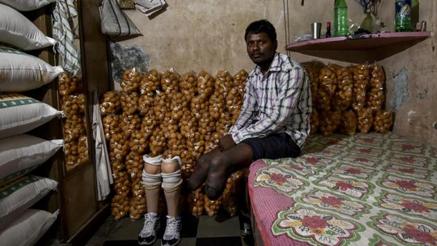 Rajbhar revisits his home in Dharavi. Owner of a small shop back in the village, Rajbhar said a debt of Rs 47,000 which he had taken for the artificial limbs is still pending completion. (Kunal Patil / HT Photo)