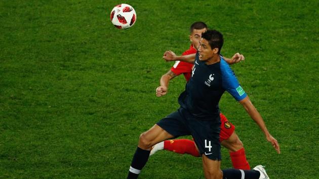 France's defender Raphael Varane (front R) vies for the ball with Belgium's forward Eden Hazard. (AFP) France's defender Raphael Varane (front R) vies for the ball with Belgium's forward Eden Hazard. (AFP)