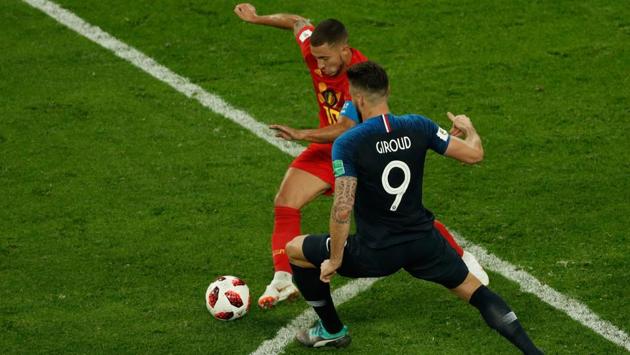 Belgium's forward Eden Hazard (rear C) vies for the ball with France's forward Olivier Giroud. (AFP) Belgium's forward Eden Hazard (rear C) vies for the ball with France's forward Olivier Giroud. (AFP)