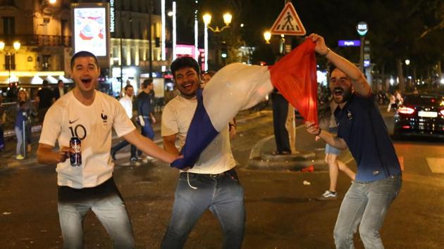 Tens of thousands of fans poured on to the Champs Elysees as bars, cafes and restaurants enjoyed a bumper evening of revelry. (AFP)