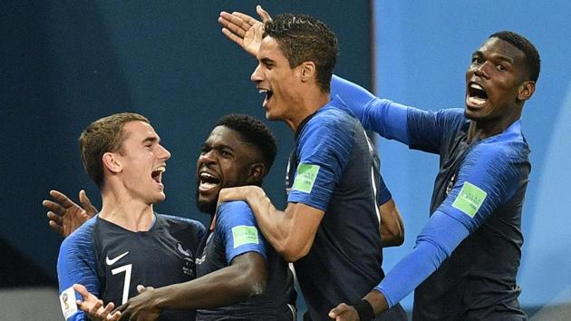 France's Samuel Umtiti (2L) is congratulated by teammates Antoine Griezmann (L), Raphael Varane (2R) and Paul Pogba after scoring the only goal during the semi-final match between France and Belgium at the 2018 FIFA World Cup in the St. Petersburg Stadium in St. Petersburg, Russia on July 10, 2018. France won 1-0. (AP)